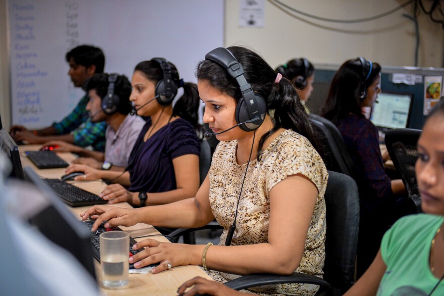 The proportion of women in India's workforce — like these staffers at a call center — is declining. Over nearly two decades, India's female labor participation rate has dropped from from 32% in 2005, to 19% in 2021. Economists are trying to figure out why.