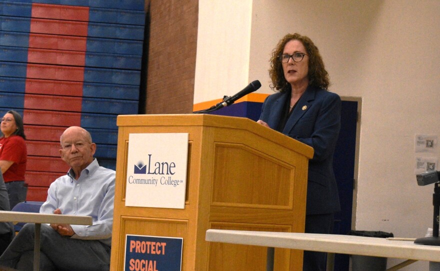 U.S Rep. Val Hoyle, D-Oregon, speaks at a town hall in Eugene on April 23, 2025, as former Rep. Peter DeFazio listens.