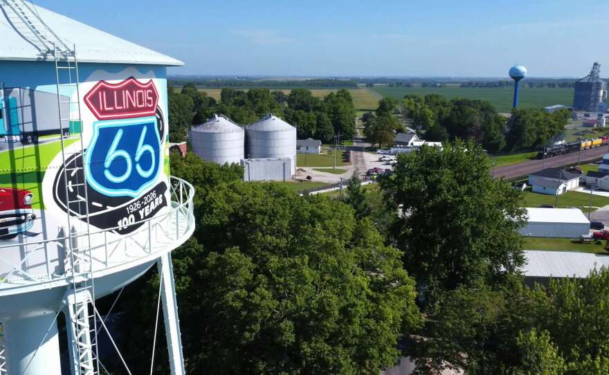 A drone shot of the water tower with the big boy train behind