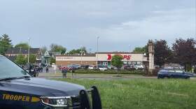 Police were on the scene Saturday, May 14 at the Tops supermarket on Jefferson Avenue in Buffalo, where a gunman opened fire on members of the public. (Emyle Watkins / WBFO News)