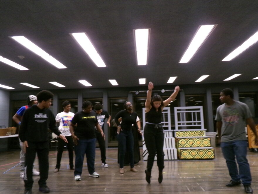 Dancers run through a dance sequence that infuses tap, Afrobeats and Swing dancing.