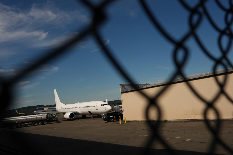 FILE - A U.S. Immigration and Customs Enforcement flight operates out of King County International Airport-Boeing Field, Aug. 23, 2025, in Seattle.