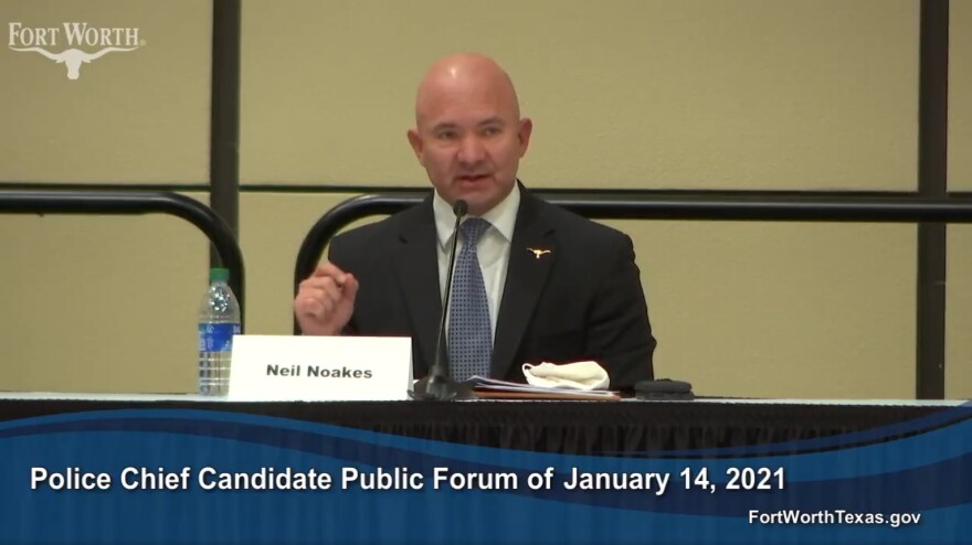 In a screengrab, Fort Worth Deputy Chief Neil Noakes sits at a table and speaks into a microphone.