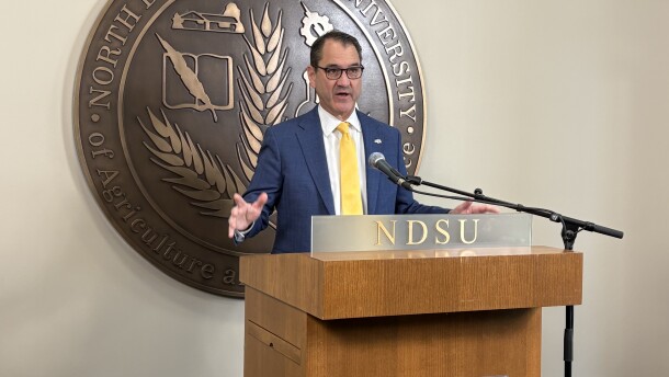 NDSU President Dr. David Cook speaks to reporters.