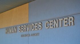 Oklahoma Human Services halted two proposed rule changes that would have altered subsidies for child care and a quality rating system for child care providers. A sign marks an Oklahoma Human Services office in Oklahoma County.