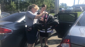 Child Passenger Safety Instructor Jodi Henderson training expecting mother Stephanie Cunningham. 