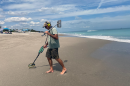 <i>Paul Keech looks for all sorts of treasures while metal detecting on Melbourne Beach, Florida. (Savannah Rude/WUFT News)</i>