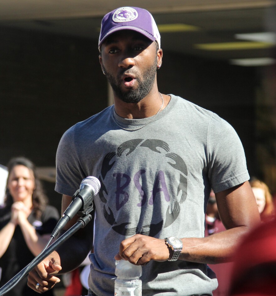 (Photo by Lydia Lawson) Khamisie Green speaks to a crowd gathered outside of ACU's Campus Center about race issues. 