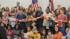 Governor Sarah Huckabee Sanders, with students and staff, cut the ribbon to Easterseals Arkansas Academy in West Little Rock