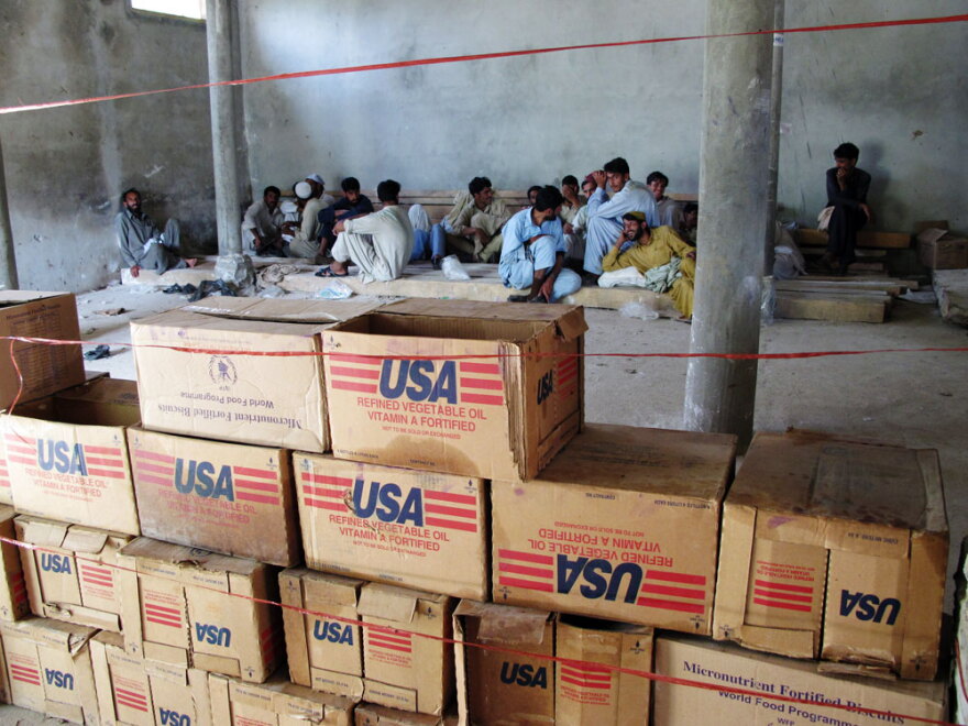 Workers at the Khyber Pukhtoonkhwa food distribution center lack the proper paperwork to deliver the emergency food aid that is stockpiled around them.