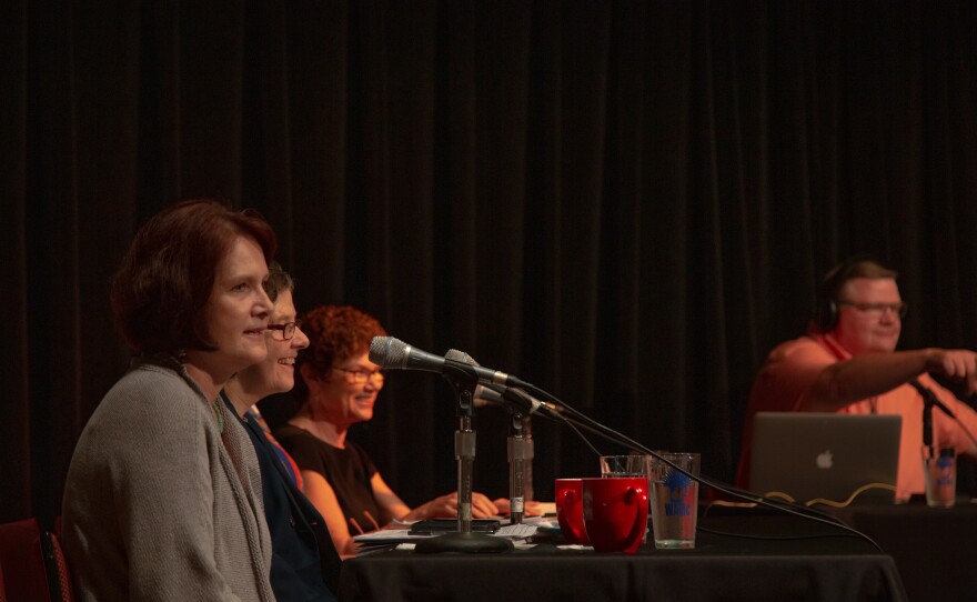 Panelists on stage at The Linda