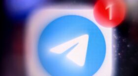 The mobile messaging and call service Telegram logo is displayed on a smartphone screen.