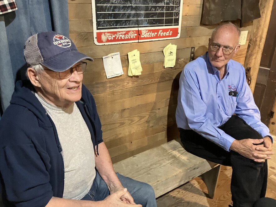 Fair Grove volunteers Dan Manning and Steve Short chat with an Ozarks Public Radio reporter on September 12, 2024 about the decades-long effort to restore and preserve the Wommack Mill at the center of town.