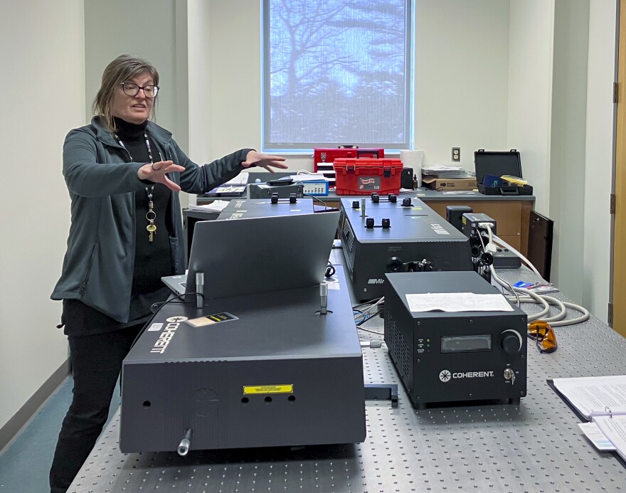 Sanela Lampa-Pastirk, associate professor and co-director of Nazareth's biomedical science program,works on a system of advanced lasers that use light to study extremely fast processes.: