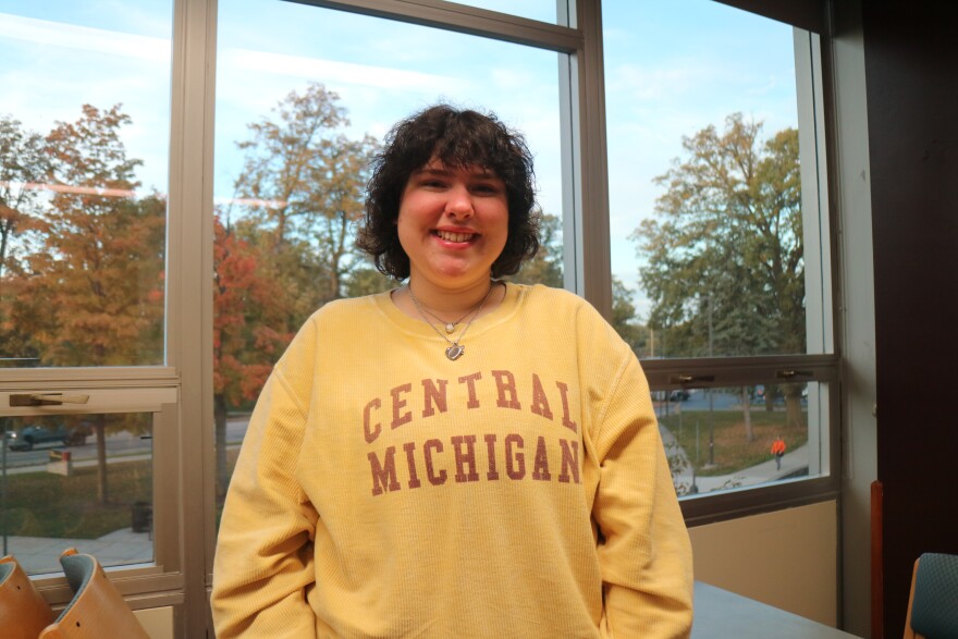 Erika Thomas is a second year student at Central Michigan University, she is studying music education. Her hometown is Stanton, MI. She stands on the third floor of the University Center in the Lake St. Clair room.