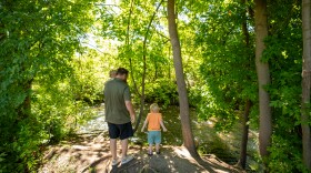A family plays near the Little Logan River on Thursday, June 11, 2026.