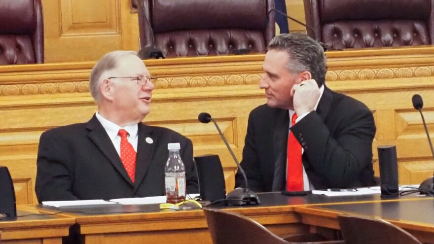 Senate President Ty Masterson, right, and House Speaker Dan Hawkins received a letter from the White House Office of Intergovernmental Affairs praising the 2026 Kansas Legislature's support of priorities set forth by President Donald Trump. This is a 2025 image of Masterson and Hawkins chatting at the Kansas Capitol.