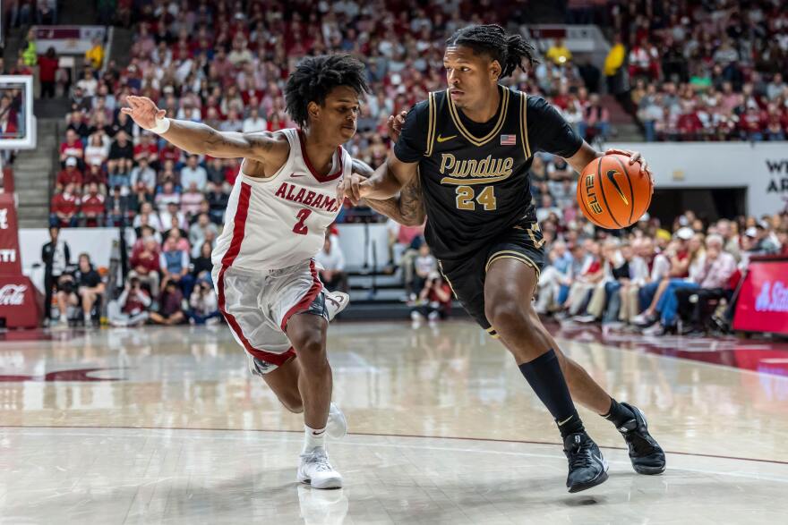 Purdue guard Gicarri Harris (24) works against Alabama guard Aden Holloway (2) during the second half of an NCAA college basketball game, Thursday, Nov. 13, 2025, in Tuscaloosa, Ala. (AP Photo/Vasha Hunt)