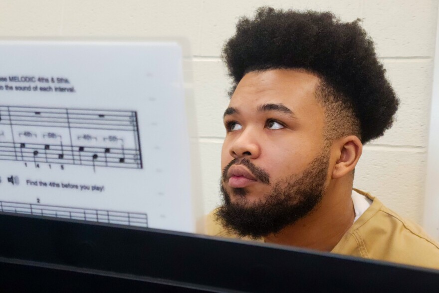 Sean Michael Harrold, 23, listens to the piano instructor during the last day of the piloted Melodies of Hope piano class at the Buzz Westfall Justice Center on May 19 in Clayton.