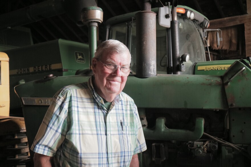 Dennis Kellogg stands in front of his 2003 John Deere Tractor. Kellogg said it's his the newest tractor he has.