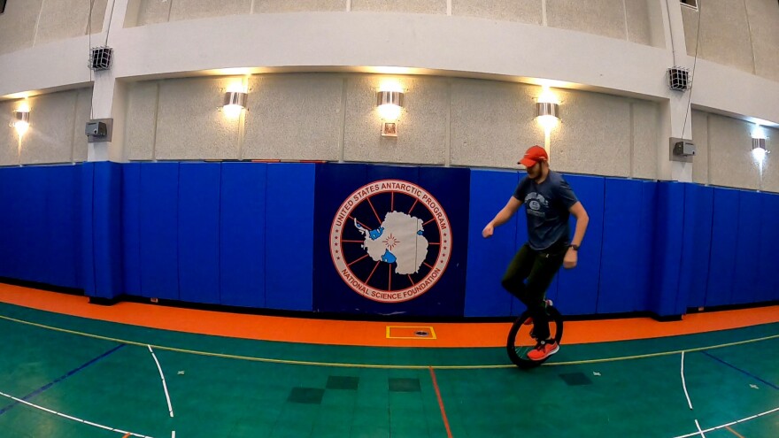 Dr. John-Michael Watson works on his unicycling last year at a research station at the South Pole. The station has an active unicycling club.