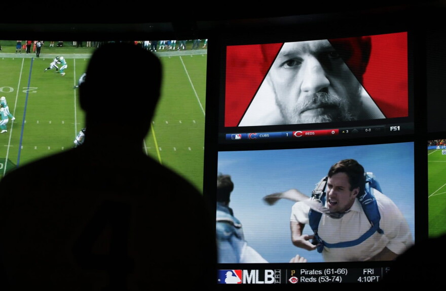 An ad featuring Conor McGregor plays on a screen at the Westgate Superbook sports book, Thursday, Aug. 24, 2017, in Las Vegas. (John Locher/AP)