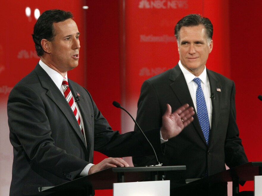 Rick Santorum and Mitt Romney took the stage in a January presidential debate in Florida. They'll meet again Wednesday night in Arizona, which holds its primary on Feb. 28, the same day as the crucial Michigan contest.