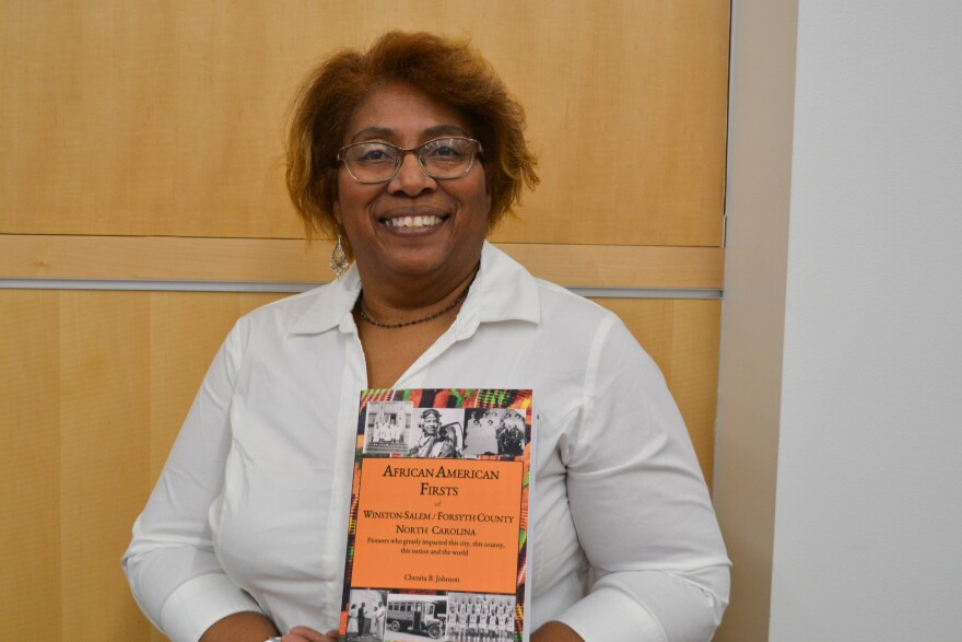 Chenita Johnson, the vice president of the Winston-Salem African American Archive, said that researching and writing her book for 12 years was a "labor of love," but also "a blessing." The book tells the stories of African American firsts in Winston-Salem/Forsyth County dating back to 1763. AMY DIAZ/WFDD