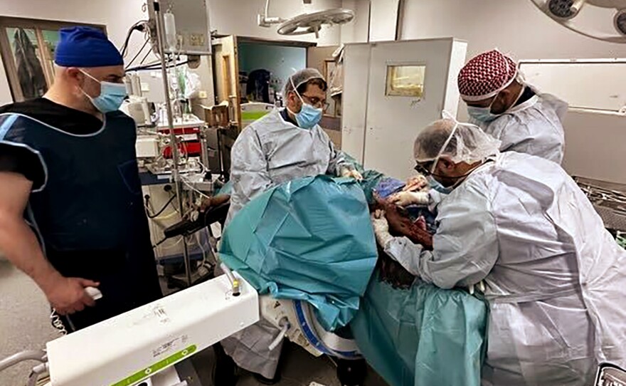 Dr. Ali Elaydi and Umar Burney working on infected nonunion from previous injury reports earlier in the war