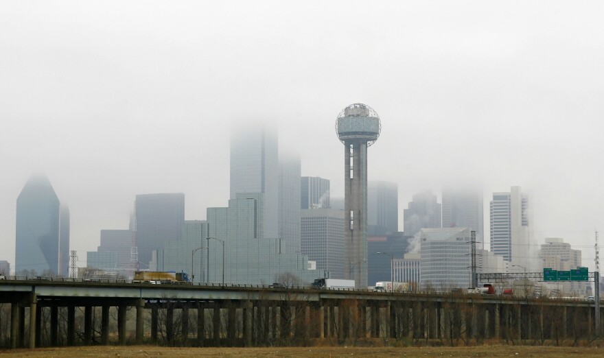 Commuters make their way into downtown Dallas.