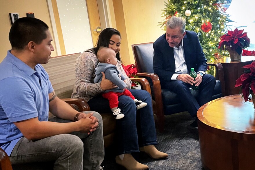 Jose Del Pezo and his son Leonardo Del Pezo and is wife Sarith Restrepo talk with Governor Ned Lamont at the Bridgeport hospital lobby as he announced Connecticut’s home health visit program for newborns in Bridgeport to expand to Norwich December 9th 2024.