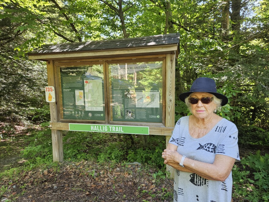 Bobbie Hallig stands by the trail named in her honor at Mount Plantain Preserve in Mount Washington, Massachusetts.