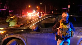 Federal immigration officers at the scene of a reported shooting Wednesday, Jan. 14, 2026, in Minneapolis.