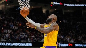 Los Angeles Lakers forward LeBron James goes to the basket in the second half of an NBA basketball game against the Cleveland Cavaliers in Cleveland, Wednesday, Jan. 28, 2026.
