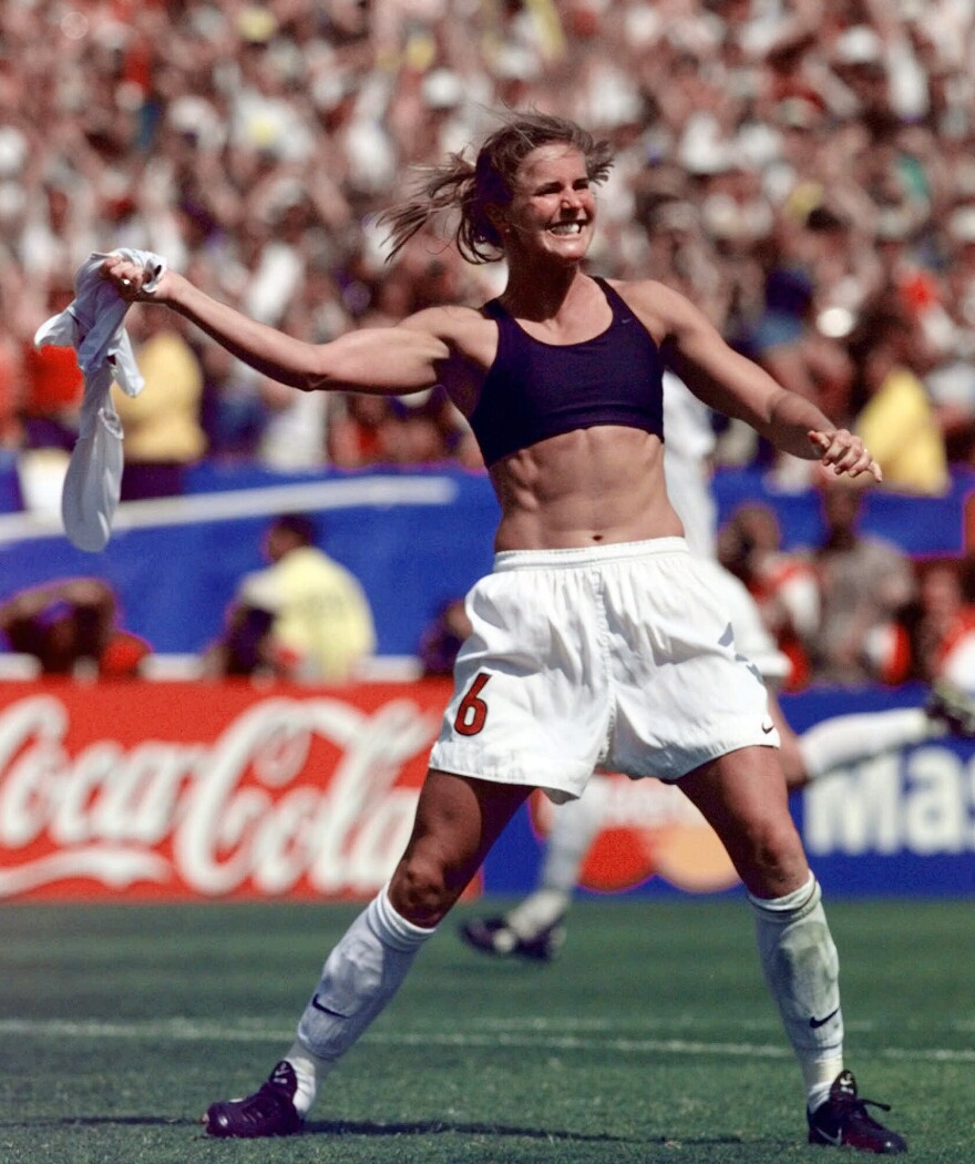 Brandi Chastain celebrates by taking off her jersey after kicking in the game-winning goal in penalty shootout goal against China in the FIFA Women's World Cup Final at the Rose Bowl in Pasadena, Calif.