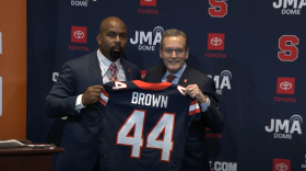 Syracuse Athletic Director John Wildhack presents Football Head Coach Fran Brown with a Syracuse Jersey