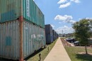 The long line of double-stacked containers behind SOMO Walls will be transformed by some of the community's most talented muralists.