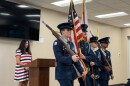 Christine Dobkowski (left) viewing the Belleview JROTC present the colors at the Freedom Walk event in the Belleview Community Center.