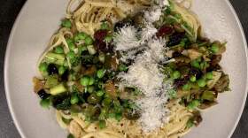 Linguine with mixed olives, spring peas and parsley. (Kathy Gunst/Here & Now)