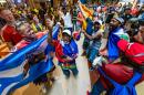 Scottish and Haitian fans dance and chant together inside South Station before a World Cup match in Foxborough. (Jesse Costa/WBUR)