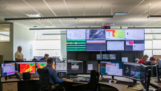 Meteorologists work in the National Weather Service office in Norman.