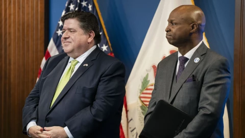 House Speaker Emanuel “Chris” Welch stands beside Gov. JB Pritzker during a 2024 news conference in the West Loop.