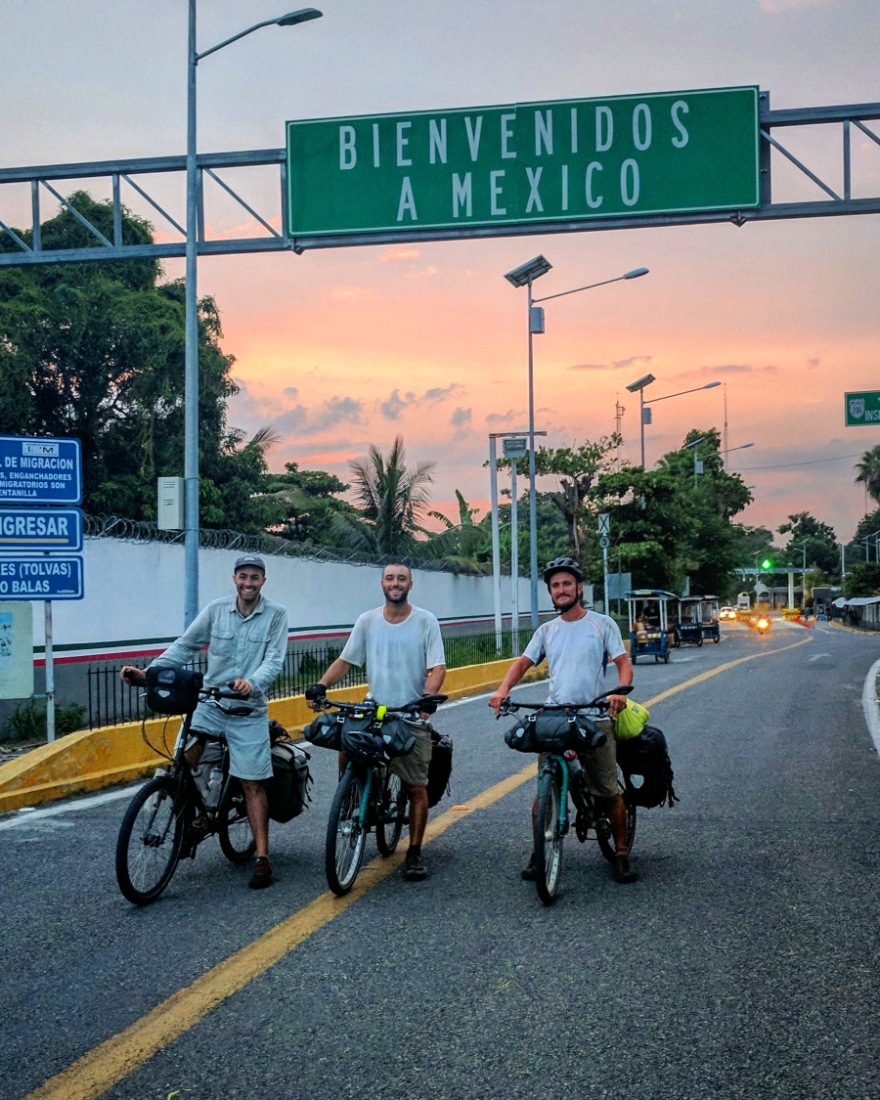 Russell, Bennett, and McCarter ride across the Guatemala-Mexico border as part of their 12,000 mile journey up the Americas. 