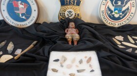 A terracotta figure, spearheads and stone tools presented at the repatriation ceremony.