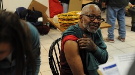 Resident Danny Pellum gets ready to be vaccinated against Hepatitis A at the Yakima Union Gospel Mission shelter Wednesday. He says he decided to get the shot just to be safe. “I don’t want no surprises later in my life when I could have done something about it tonight,” Pellum said. CREDIT: Enrique Pérez de la Rosa/NWPB