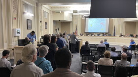 People initially lined up to speak to members of the Urban Growth Management Advisory Committee. Fire code regulations then prompted the chair to call speakers one by one to the podium