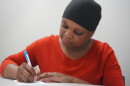 Elsie Alex-Tanner, crisis intervention specialist at Marion Senior Services, writing on her notepad. (Rachel Hunter/WUFT News)