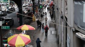People walk through a neighborhood in the Queens borough of New York City. The U.S. surpassed 500,000 COVID-19 deaths this week.
