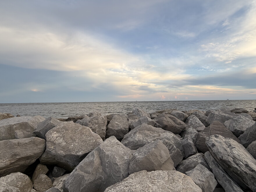 Sunset over the Gulf of Mexico on the rocky beach at Dauphin Island Sea Lab.