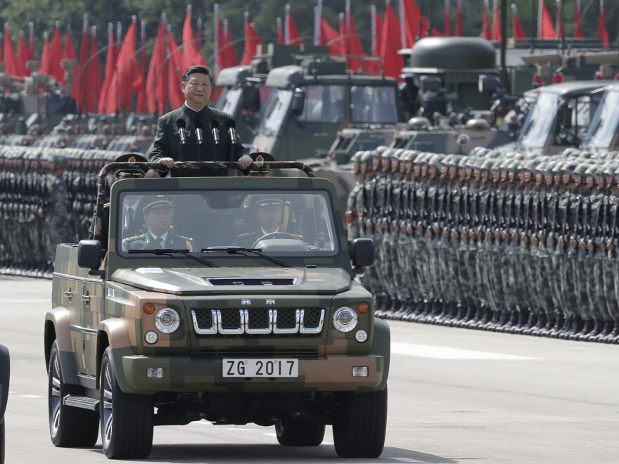 Chinese President Xi Jinping inspects Chinese troops of the People's Liberation Army in Hong Kong on Friday. Xi landed in Hong Kong Thursday to mark the 20th anniversary of Beijing taking control of the former British colony.